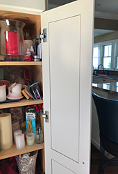 Stained cabinet doors, after repair by Home Enhancements.