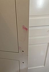 Stained cabinet doors, before repair by Home Enhancements.