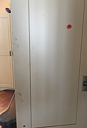 Stained cabinet doors, before repair by Home Enhancements.