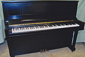 Piano, after restoration by Home Enhancements.