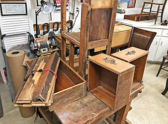 Components of a beautiful piece of heirloom furniture, prior to its restoration and assembly.