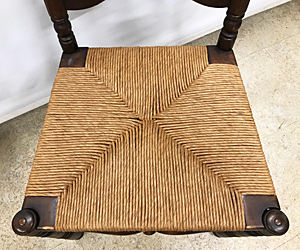 Woven chair seat detail, after repair by Home Enhancements.