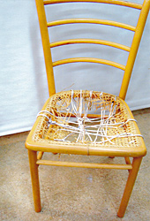 Woven chair seat, before repair by Home Enhancements.